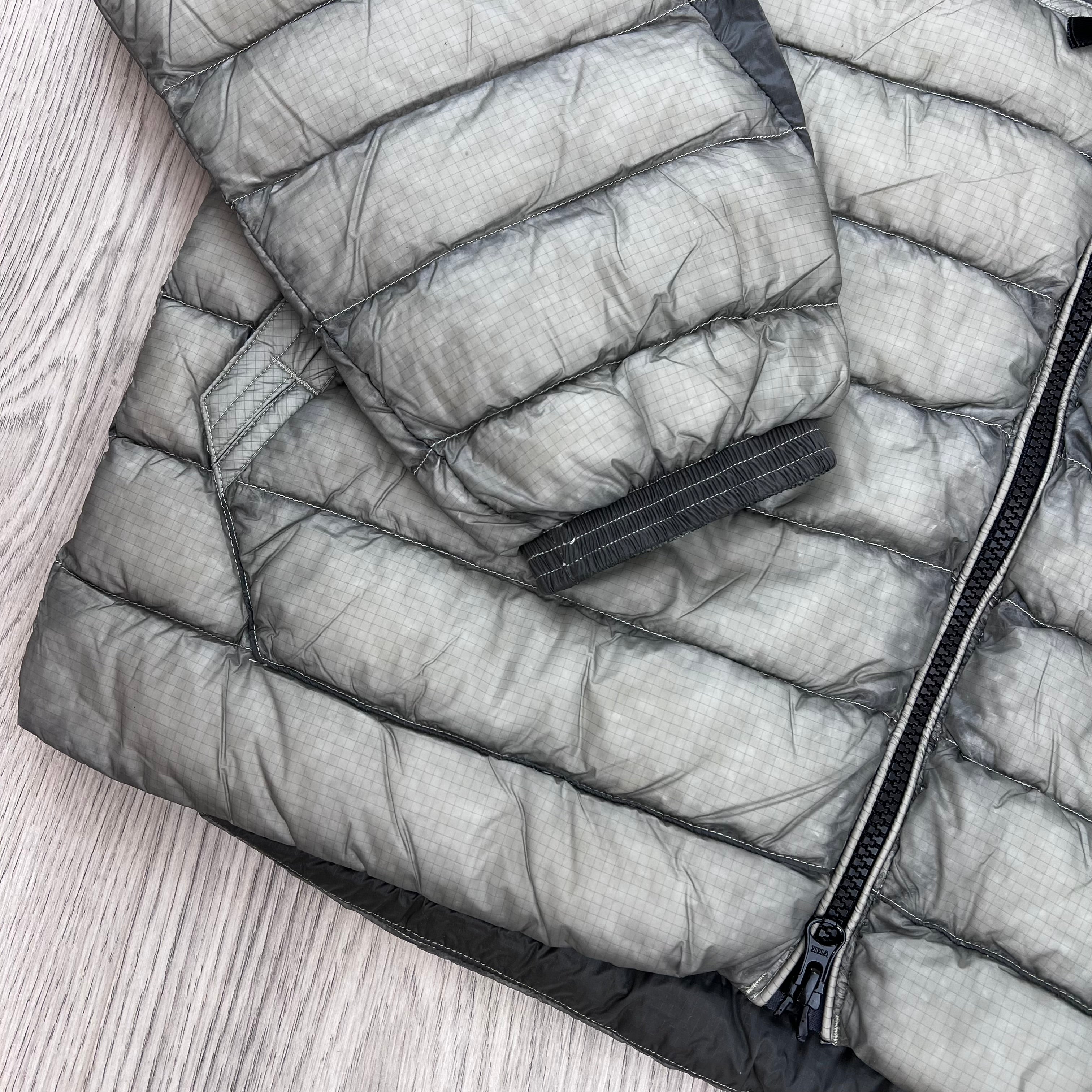 A close up view of the 7-denier opaque nylon micro-ripstop material on the CP Company D.D. Shell Goggle Jacket in Flint Grey.