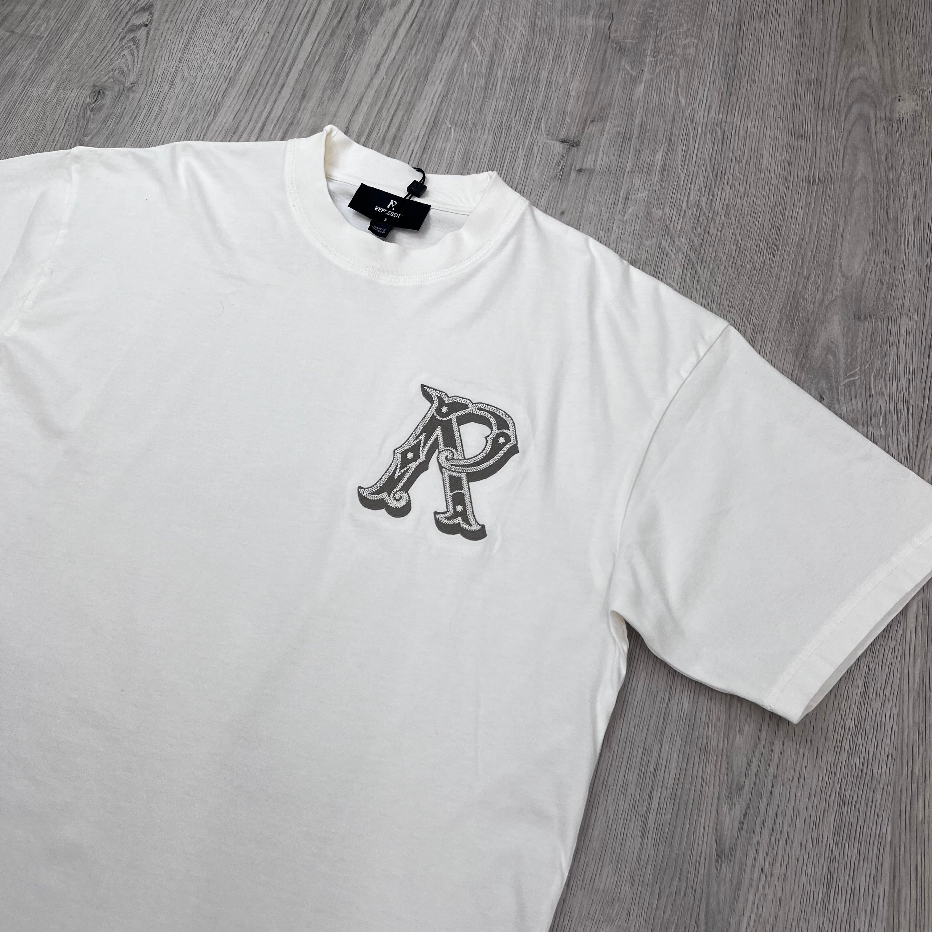 Represent 'Western Initials' T-Shirt in Flat White - Angled view.