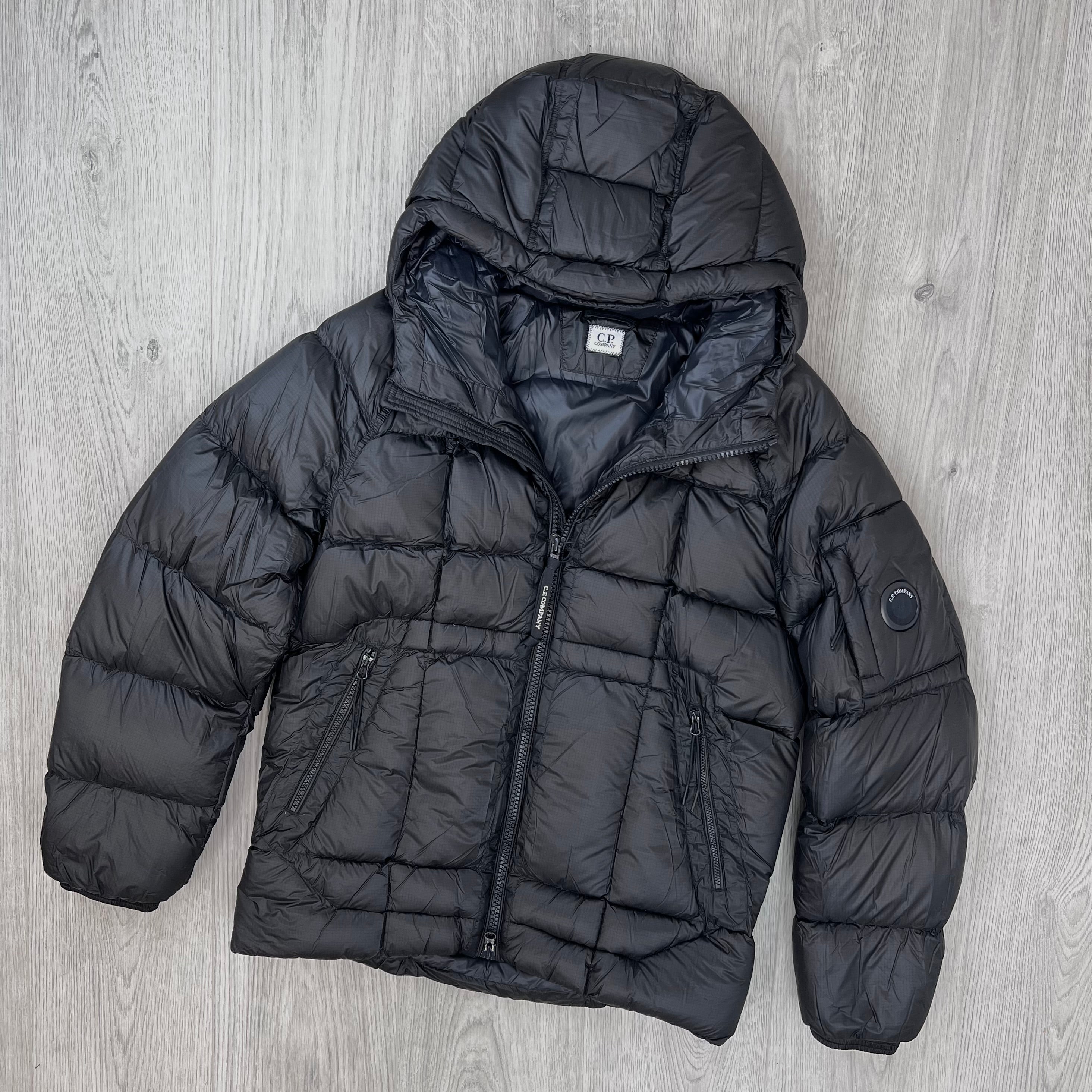 The front view of a CP Company D.D. Shell Hooded Down Jacket in Black. 